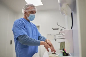 a surgeon washing his hands